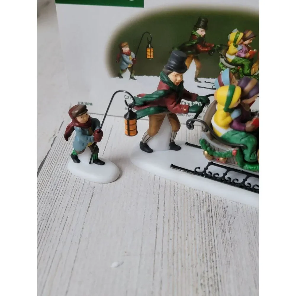 Dept 56 58396 Caroling With The Cratchit Family (Revisited) village accessory xm